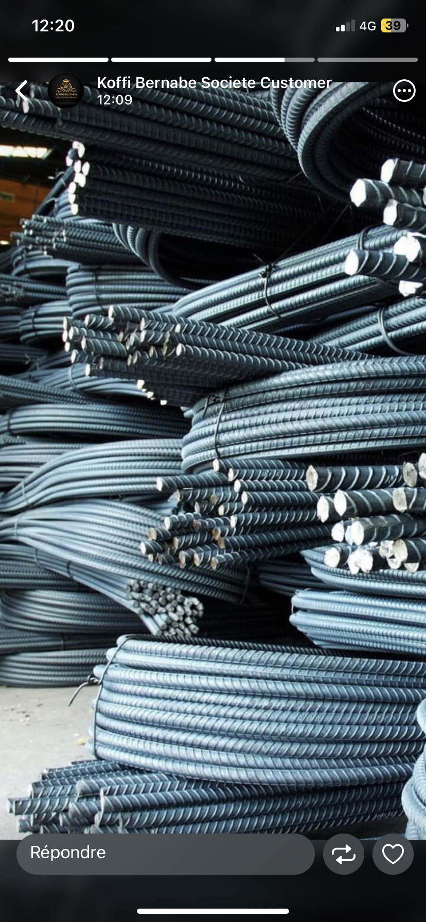 Stacks of bundled steel rebar coils in a warehouse storage yard.